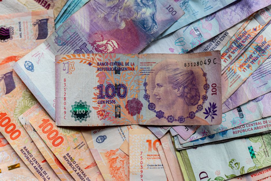 argentina — A collection of colorful Argentinian peso bills, featuring diverse denominations and designs.