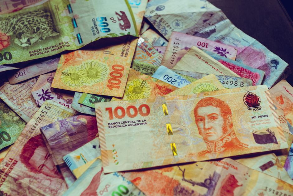 argentina — A vibrant collection of Argentine peso banknotes showcasing diverse designs and denominations.
