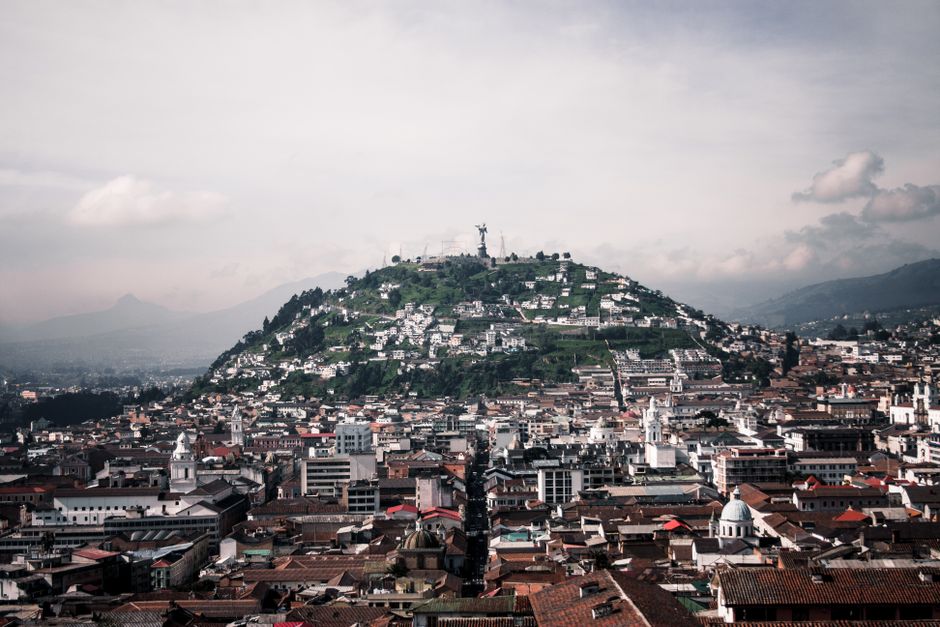 ecuador — Aerial view of Quito featuring Panecillo Hill and Virgin statue, capturing historic architecture and