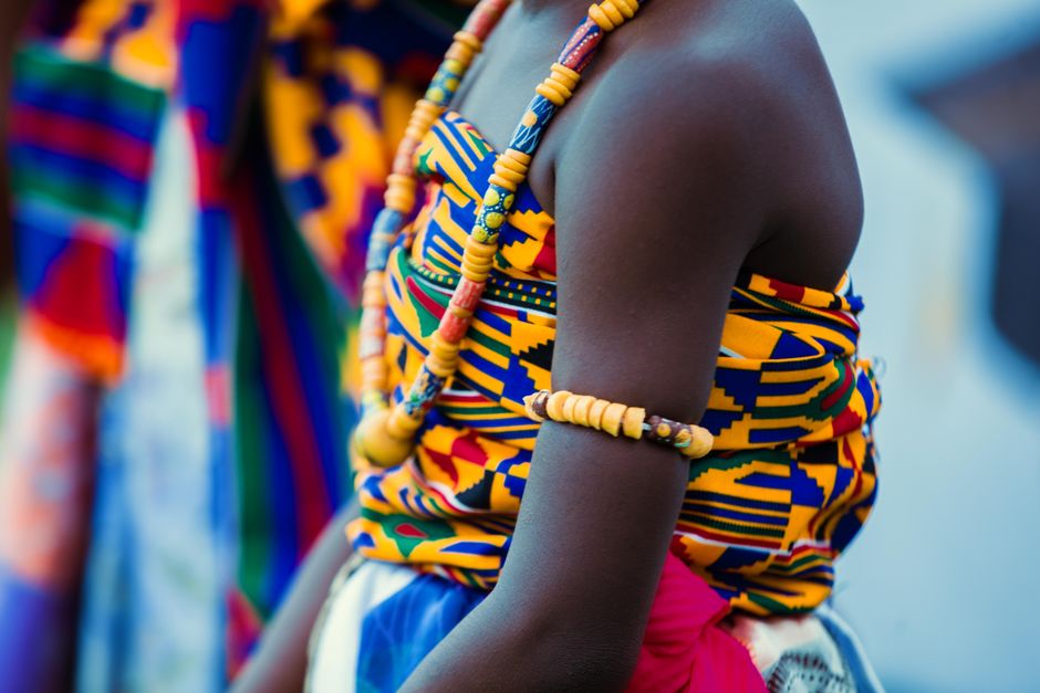 ghana — Vibrant traditional Ghanaian attire with beads and kente cloth, highlighting cultural identity.