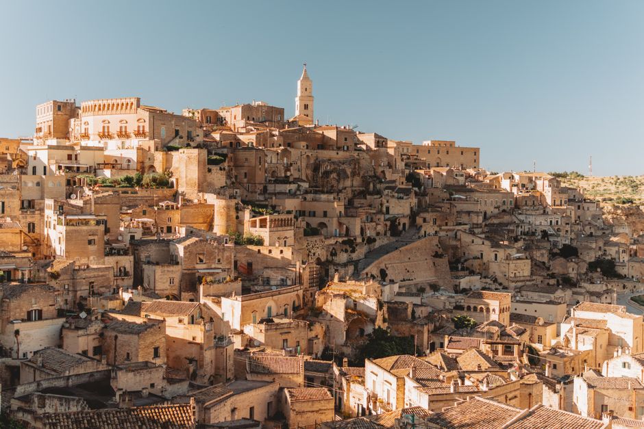 italy — Explore the ancient stone dwellings of Matera, Italy, a UNESCO World Heritage site bathed in golden 