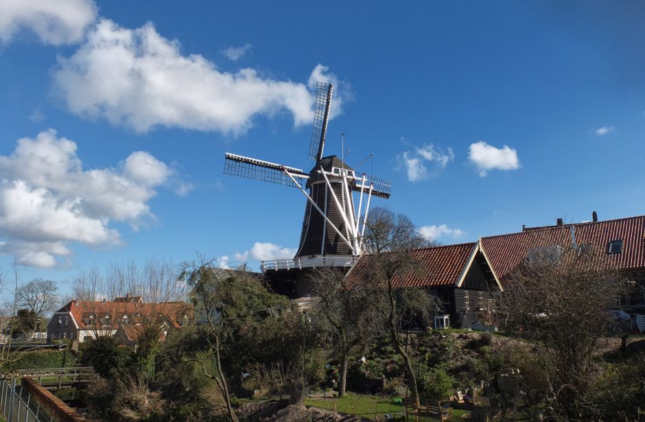 netherlands — A scenic view of a traditional windmill in Hattem, Gelderland on a sunny day.