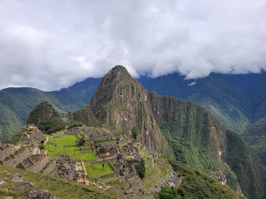 peru — Stunning aerial view of the historic Machu Picchu in the Andes mountains, showcasing its ancient arc