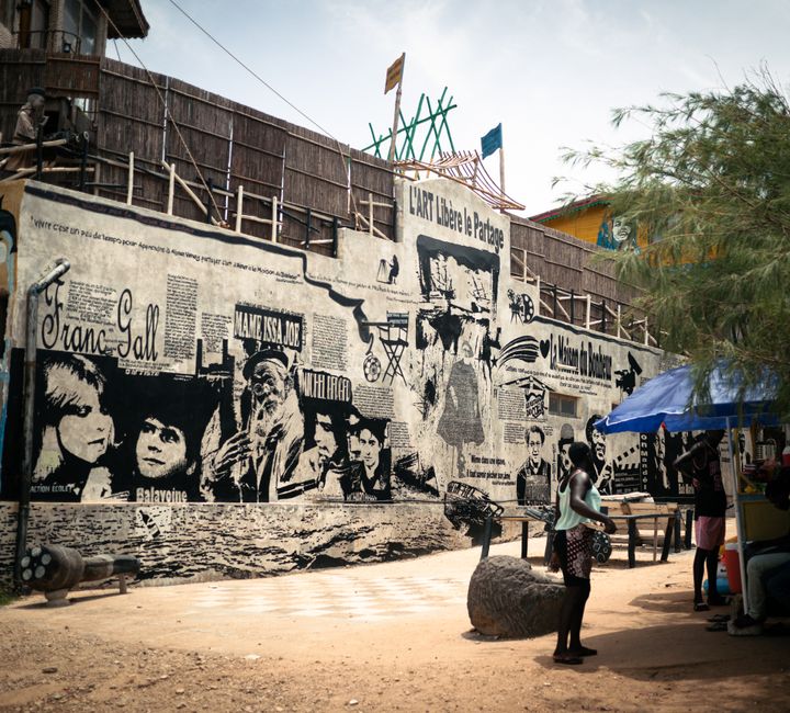 senegal — A vibrant street mural in Senegal depicting urban life and artistic expression.
