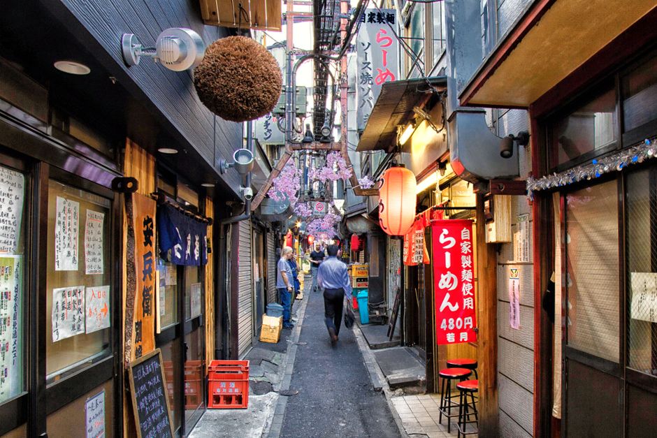 Explore a vibrant alleyway in Tokyo, Japan, featuring traditional restaurants and unique atmosphere.