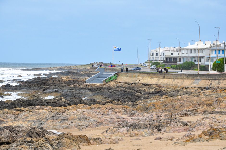 uruguay — Coastal scene with rocky shore and cityscape in Punta del Este, Uruguay.